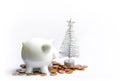 Piggy bank with coins. White ceramic moneybox Royalty Free Stock Photo