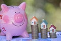 Piggy bank, concept of saving money for house, Savings money for buy house and loan to business investment for real estate concept Royalty Free Stock Photo