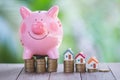 Piggy bank, concept of saving money for house, Savings money for buy house and loan to business investment for real estate concept Royalty Free Stock Photo