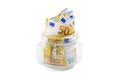 Piggy bank with euros on an isolated background