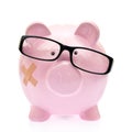 Piggy bank with eyeglasses