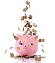 Piggy bank with falling coins Royalty Free Stock Photo