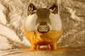 Piggy bank golden on a gold background. Business and Finance
