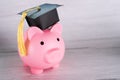 Piggy bank with graduation cap, Business finance education saving money scholarship concept