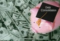Piggy bank with graduation cap on cash and Debt Consolidation text Royalty Free Stock Photo