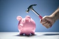 Piggy bank and hand with hammer about to smash to get at savings Royalty Free Stock Photo