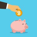 Piggy bank, hand holds golden bitcoin coin virtual money. Cryptocurrency and saving concept