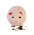 Piggy bank with house keys isolated Royalty Free Stock Photo