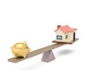 Piggy bank and house on the seesaw.3D illustration