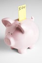 Piggy bank with IOU Royalty Free Stock Photo