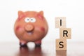 Piggy bank and IRS word Royalty Free Stock Photo