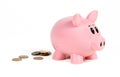 Piggy Bank Leaves Piles of Pennies Behind Royalty Free Stock Photo