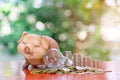 A piggy bank and light bulb on money stack for saving money concept Royalty Free Stock Photo