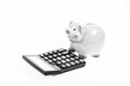 Piggy bank money savings. Piggy bank pig and calculator. Credit debt concept. Economics and profit management. Economics Royalty Free Stock Photo