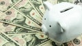 Piggy bank on a pile of ten dollar banknotes, Money background. Royalty Free Stock Photo