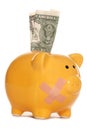 Piggy bank with plaster and one dollar bill Royalty Free Stock Photo