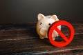 Piggy bank and prohibition sign NO. Bypass restrictions, loopholes in laws. Lifting of sanctions, unblocking and unfreezing of Royalty Free Stock Photo