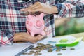 Piggy bank protected by hands, Savings protection. Royalty Free Stock Photo