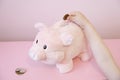 Piggy bank savings childs hand coins kids money trust fund pink furry finance