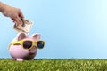 Piggy Bank retirement saving plan grass blue sky copy space Royalty Free Stock Photo