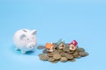 Piggy bank,  Savings money for buy house and loan to business investment for real estate concept. Invesment and Risk Management Royalty Free Stock Photo
