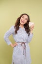 Piggy bank savings woman smiling happy. Female holding pink piggy bank isolated on white background Royalty Free Stock Photo