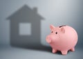 Piggy bank with shadow as house,housing industry finance concept