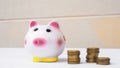 Piggy bank and stack of saving money in white background. saving money is an investment for the future. Banking investment Royalty Free Stock Photo