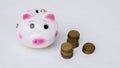 Piggy bank and stack of saving money in white background. saving money is an investment for the future. Banking investment Royalty Free Stock Photo