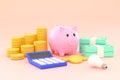 Piggy bank, stacks of coins, banknotes and calculators. savings and investment ideas