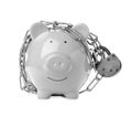 Piggy bank with steel chain and padlock. Money safety concept