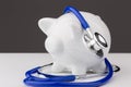Piggy bank with a stethoscope