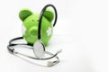 Piggy bank and stethoscope Royalty Free Stock Photo