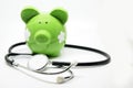 Piggy bank and stethoscope Royalty Free Stock Photo