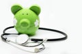 Piggy bank and stethoscope Royalty Free Stock Photo