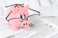 Piggy Bank Studies Tax Forms Royalty Free Stock Photo