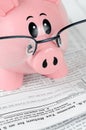Piggy Bank Studies Tax Forms Closeup Royalty Free Stock Photo