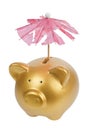 Piggy bank with tattered umbrella