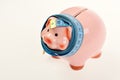 Piggy bank tied with measuring tape. Budget and squeezed savings concept. Investments and metering or counting Royalty Free Stock Photo