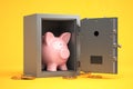 Piggy bank in vault safe. Bank savings, financials investments, saving for retirement money secure concept Royalty Free Stock Photo