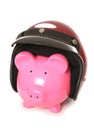 Piggy bank wearing a crash helmet