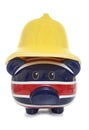 Piggy bank wearing firemans helmet Royalty Free Stock Photo