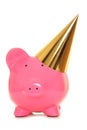 Piggy bank wearing gold party hat