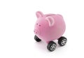 Piggy bank on wheels on white Royalty Free Stock Photo
