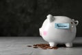 Piggy bank with word PENSION and coins on table. Royalty Free Stock Photo