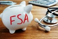 Piggy bank with letters Flexible Spending Account FSA Royalty Free Stock Photo