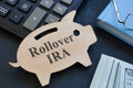 Piggy bank and words rollover IRA on it. Royalty Free Stock Photo