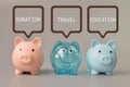 Piggy banks with text DONATION, TRAVEL and EDUCATION. Saving money and life expenses concept