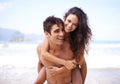 Piggyback, beach and portrait of couple on vacation, adventure or holiday for romantic travel. Happy, love and young man Royalty Free Stock Photo