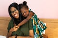 Piggyback ride with mum. Cute afican american daughter on a piggy back ride with her mother Royalty Free Stock Photo